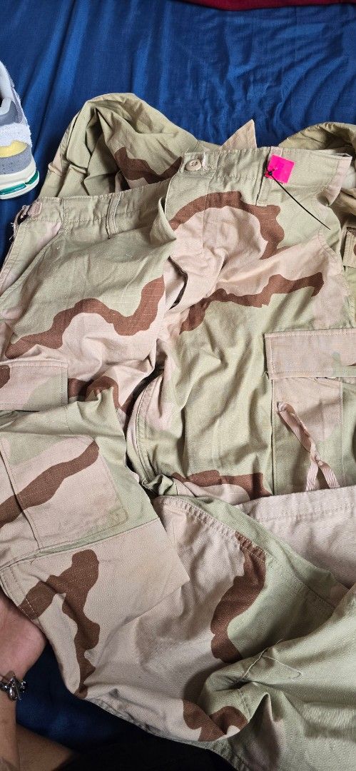 Desert Camouflage Military Uniform Set (Category: Coats, Jackets and Outerwear) located in Manila. Submitted by jungleefindss (Listing ID 1421336134, Image 3). Description: 32 to 34 pants 23 x 29 jacket forsale 2pcs 4k - Desert camouflage military uniform set - Includes jacket and pants - Button-up jacket with collared neckline - Multiple pockets on jacket and pants - Adjustable waistband on pants - Durable, possibly ripstop, fabric.
