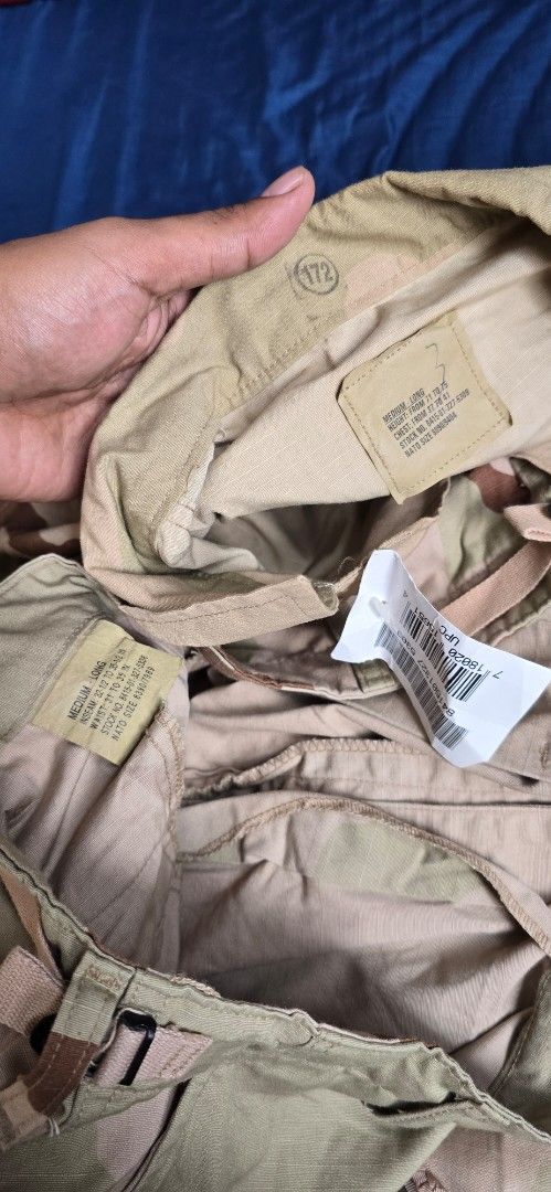 Desert Camouflage Military Uniform Set (Category: Coats, Jackets and Outerwear) located in Manila. Submitted by jungleefindss (Listing ID 1421336134, Image 2). Description: 32 to 34 pants 23 x 29 jacket forsale 2pcs 4k - Desert camouflage military uniform set - Includes jacket and pants - Button-up jacket with collared neckline - Multiple pockets on jacket and pants - Adjustable waistband on pants - Durable, possibly ripstop, fabric.