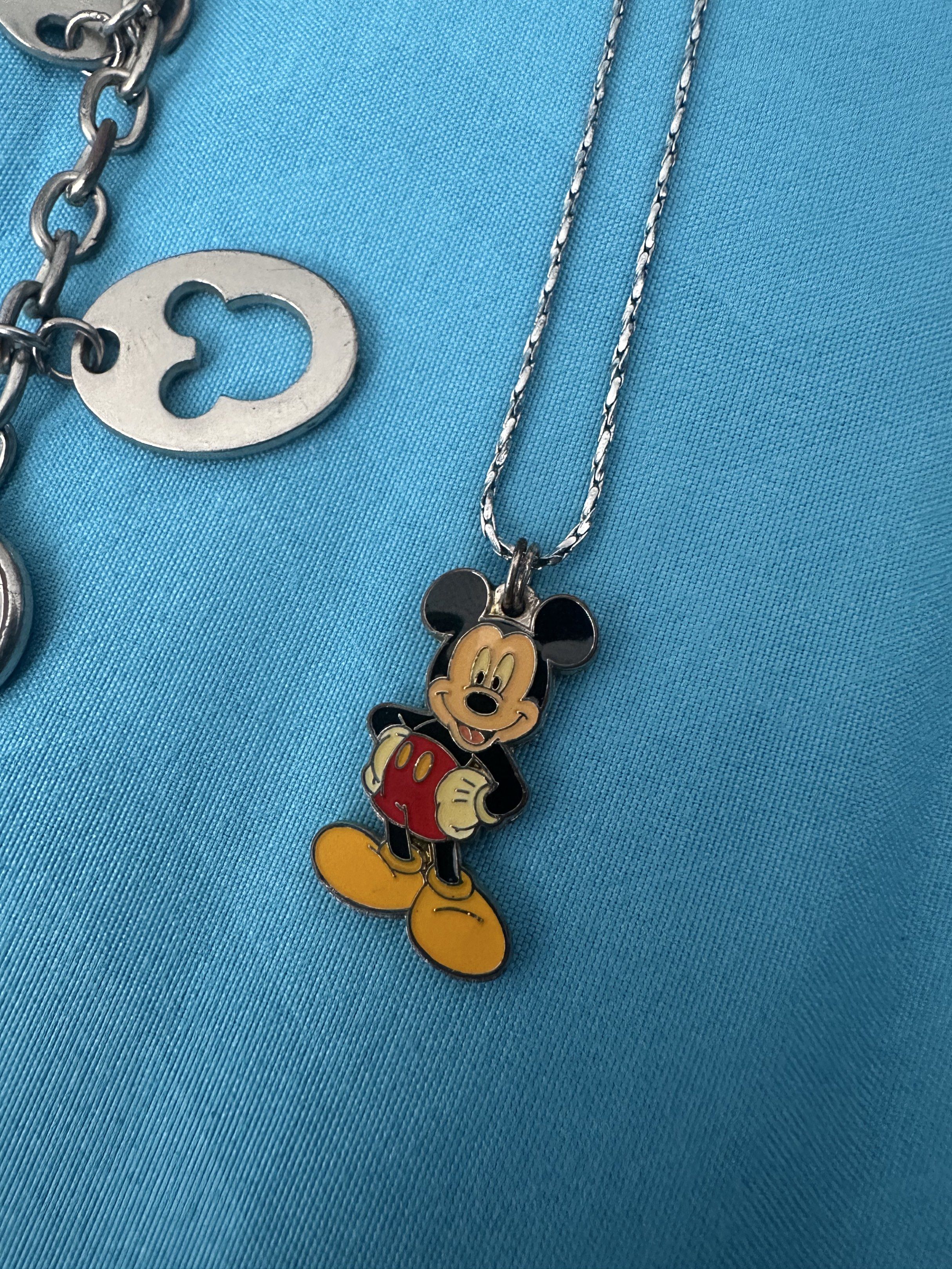 Disney Mickey Mouse Watch and Necklace Set (Category: Necklaces) located in Cainta. Submitted by richter_26 (Listing ID 1421360878, Image 3). Description: - Mickey Mouse watch with Mickey Mouse face and charm details. - Matching necklace with Mickey Mouse pendant. - Both pieces are silver-toned. - Great for Disney enthusiasts! - Bought in Hong Kong .