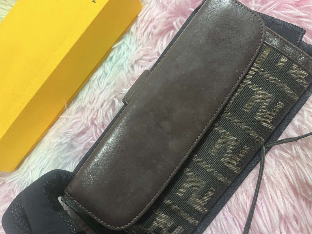 Fendi Brown Wallet with Box (Category: Luxury Bags & Wallets) located in Manila. Submitted by euphoriathriftco (Listing ID 1421429463, Image 2). Description: Authentic Fendi wallet in brown. Features the iconic Fendi logo pattern. Includes the original box, dust bag, and authenticity cards. The wallet has a snap closure and multiple compartments for cards and cash. The exterior shows some signs of wear. Comes with all the original packaging..