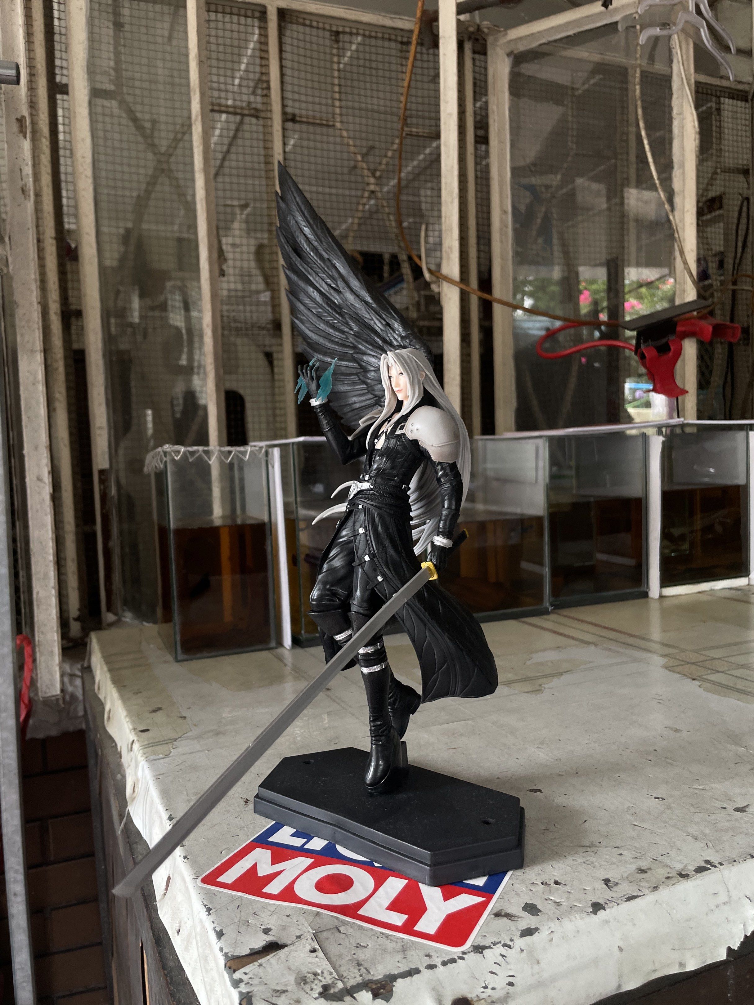 Final Fantasy VII Sephiroth Figure (Category: Figurines & Statues) located in Quezon City. Submitted by haloord (Listing ID 1421307825, Image 2). Description: - Sephiroth figure from Final Fantasy VII - Detailed sculpting and dynamic pose - Includes a large black wing and sword - Displayed on a black base.