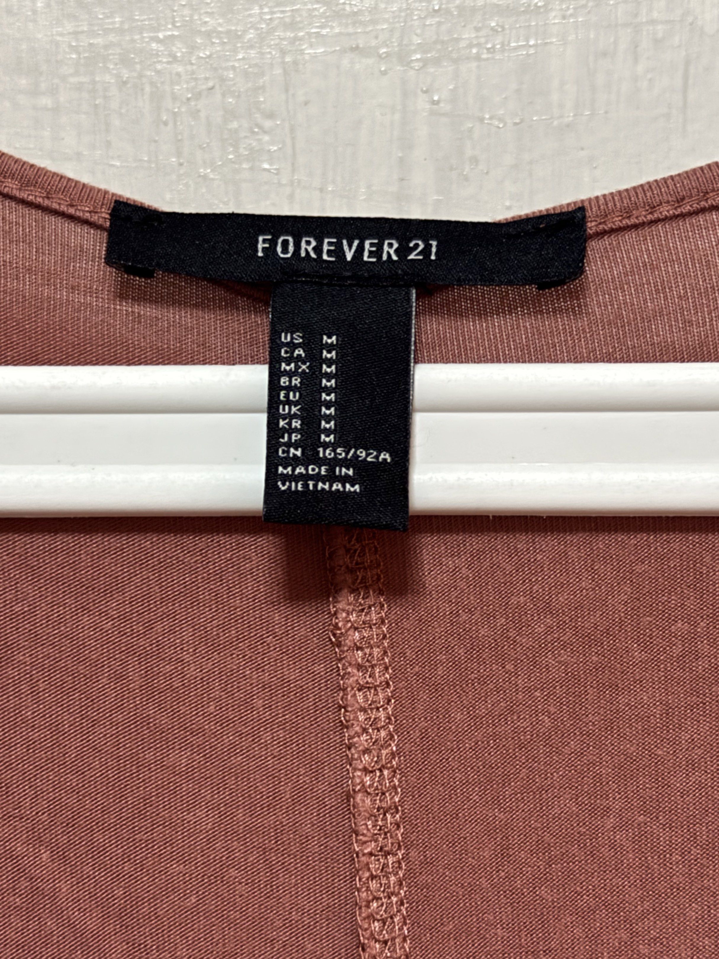 Forever 21 V-Neck Dress - Size M (Category: Dresses) located in Las Pinas. Submitted by gelds (Listing ID 1421349260, Image 3). Description: Dress from Forever 21 features a flattering V-neck design. It is a solid color and has short sleeves. The dress is a size M. Made in Vietnam..