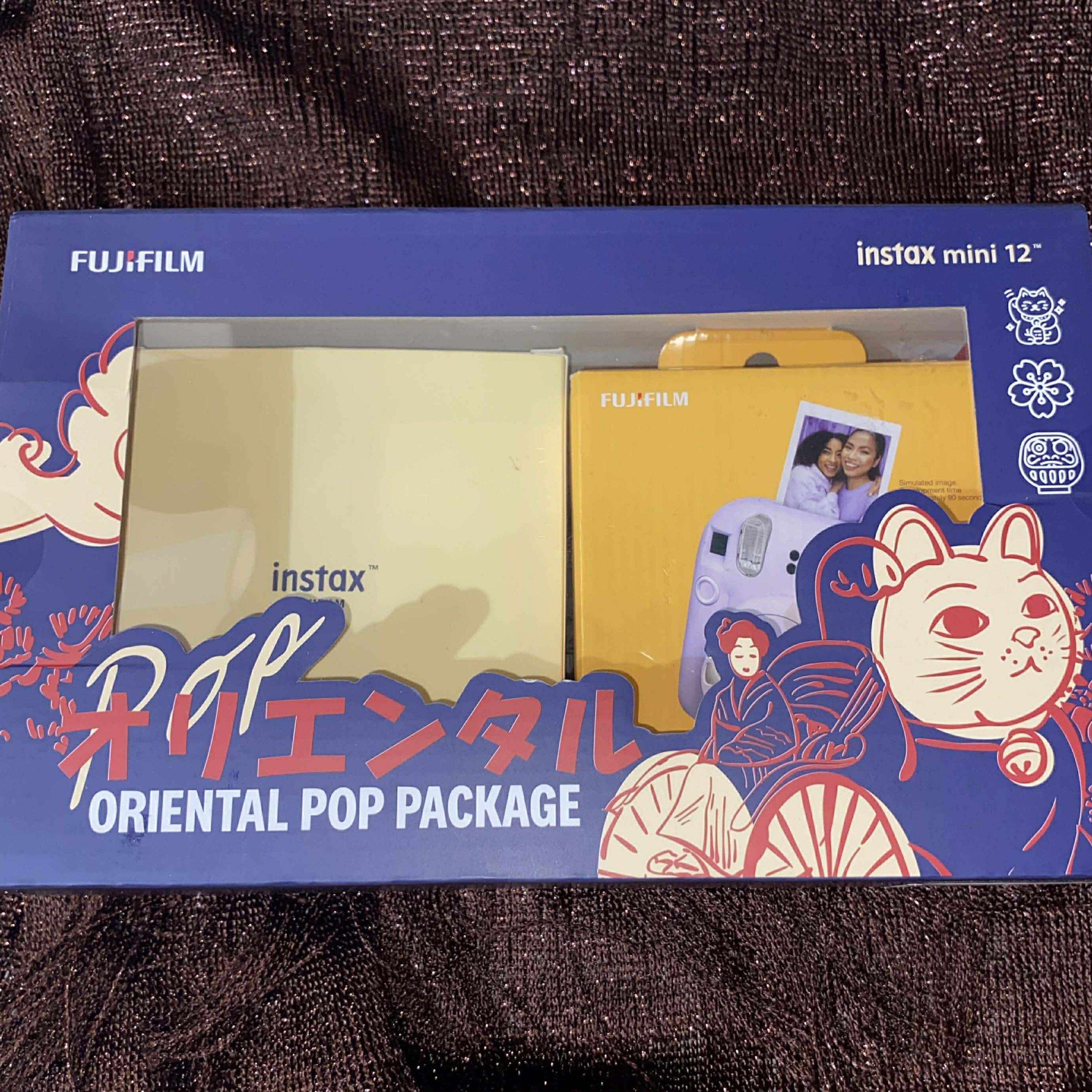 Fujifilm Instax Mini 12 Oriental Pop Package (Category: Cameras) located in Manila. Submitted by araaa312 (Listing ID 1421350119, Image 2). Description: Fujifilm Instax Mini 12 Oriental Pop Package in lavender. -Battery, -Acrilic camera case, -Acrilic film case, -Shoulder tote bag -Washi tape -Post cards.