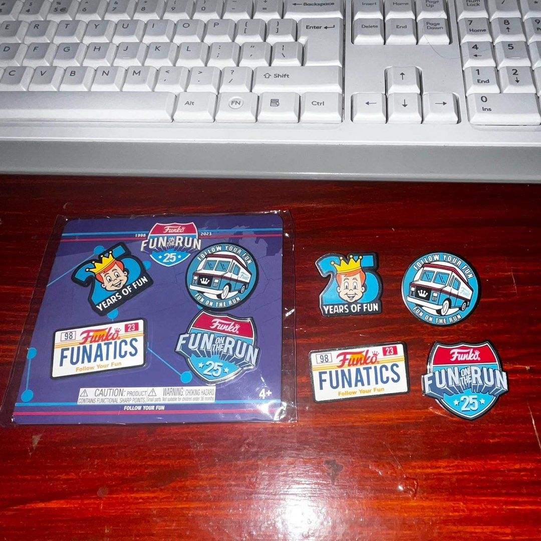 Funko Fun on the Run 25th Anniversary Pin Set (Category: Designer & Blind Box Toys) located in Del Monte. Submitted by collectandsell_ph (Listing ID 1421340330, Image 3). Description: - Funko Fun on the Run 25th Anniversary Pin Set - Includes four unique pins - Designs include Funatics license plate and Funko van - Pins are in original packaging - Perfect for Funko collectors and pin enthusiasts.
