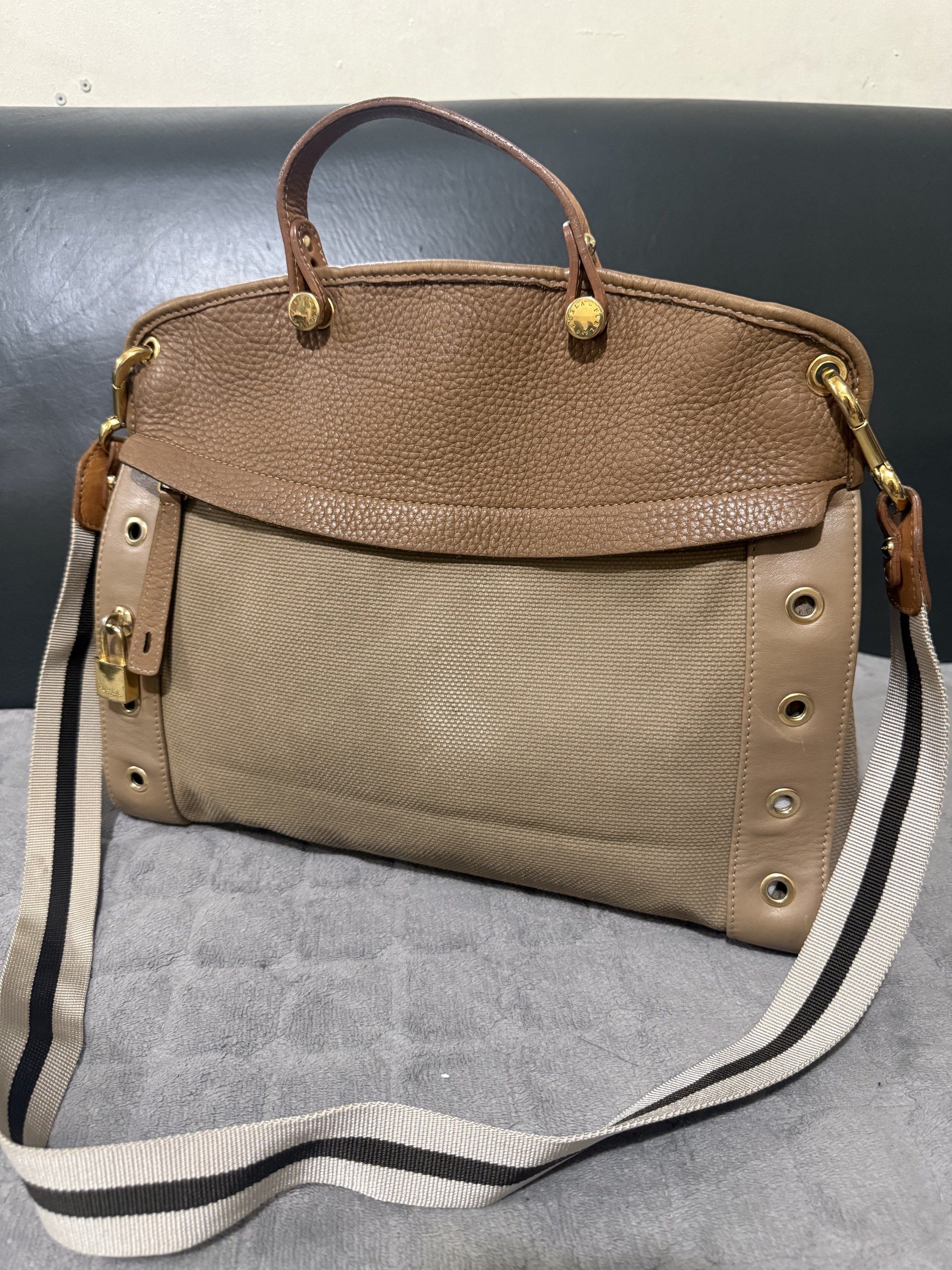 Furla piper with lock (Category: Luxury Bags & Wallets) located in Quezon City. Submitted by vianca13 (Listing ID 1421356550, Image 1). Description: Furla piper with lock Canvass/ leather Sign of use Can fit ipad / 13 inches laptop.
