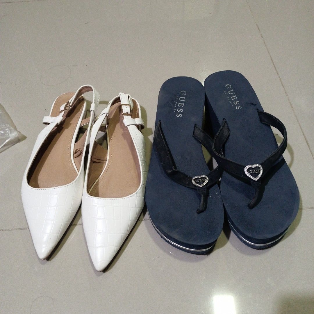 Guess and Parisian Shoes (Category: Heels) located in Quezon City. Submitted by affordable1 (Listing ID 1421325224, Image 1). Description: - Guess Platform Flip-Flops: - Color: Navy Blue - Detail: Heart - Condition: Good - Parisian Slingback Heels: - Color: White - Style: Pointed Toe, Slingback Strap - Condition: Good pick up only LOC Luzon ave qc kapilya Ng Iglesia ni Cristo landmark size 9.