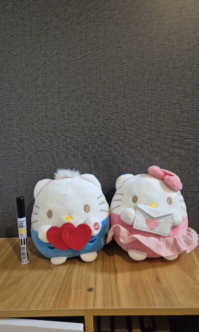 Hello Kitty Couple 7-Eleven Plush Toys (Category: Plushies & Soft Toys) located in Quezon City. Submitted by camillechua0221 (Listing ID 1416219992, Image 1). Description: Adorable Hello Kitty couple plush toy from 7-Eleven. Features two different designs, one with a pink bow and the other with a blue outfit. These plushies are soft and cuddly, perfect for Hello Kitty fans. They are ideal for collecting or gifting..