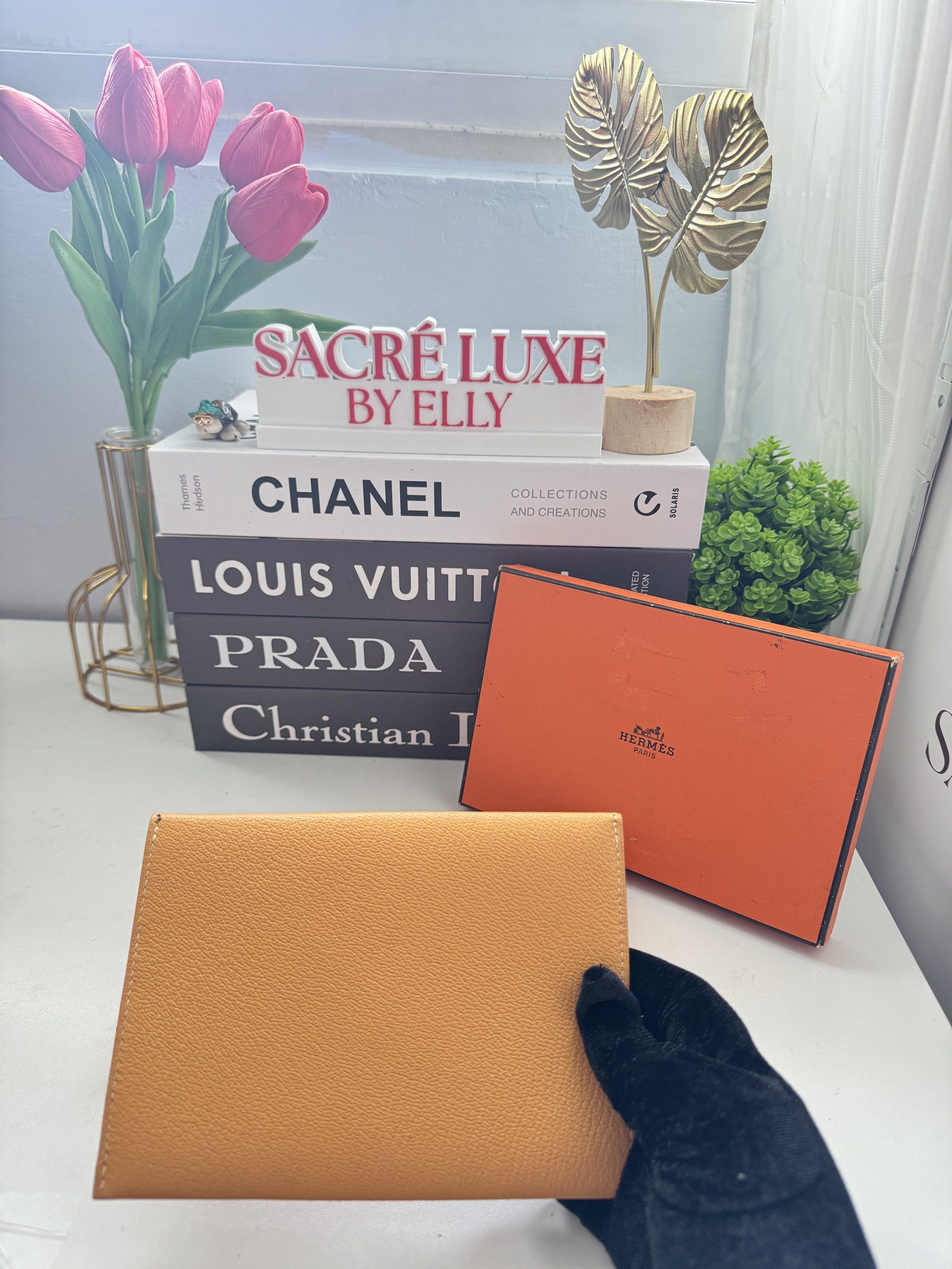 Hermès Envelope Wallet (Category: Luxury Bags & Wallets) located in Manila. Submitted by sacreluxebyelly (Listing ID 1421337644, Image 2). Description: - Authentic Hermès envelope wallet - Elegant yellow color - Unique geometric design with white stitching - Comes with original orange box - Stylish and functional accessory.