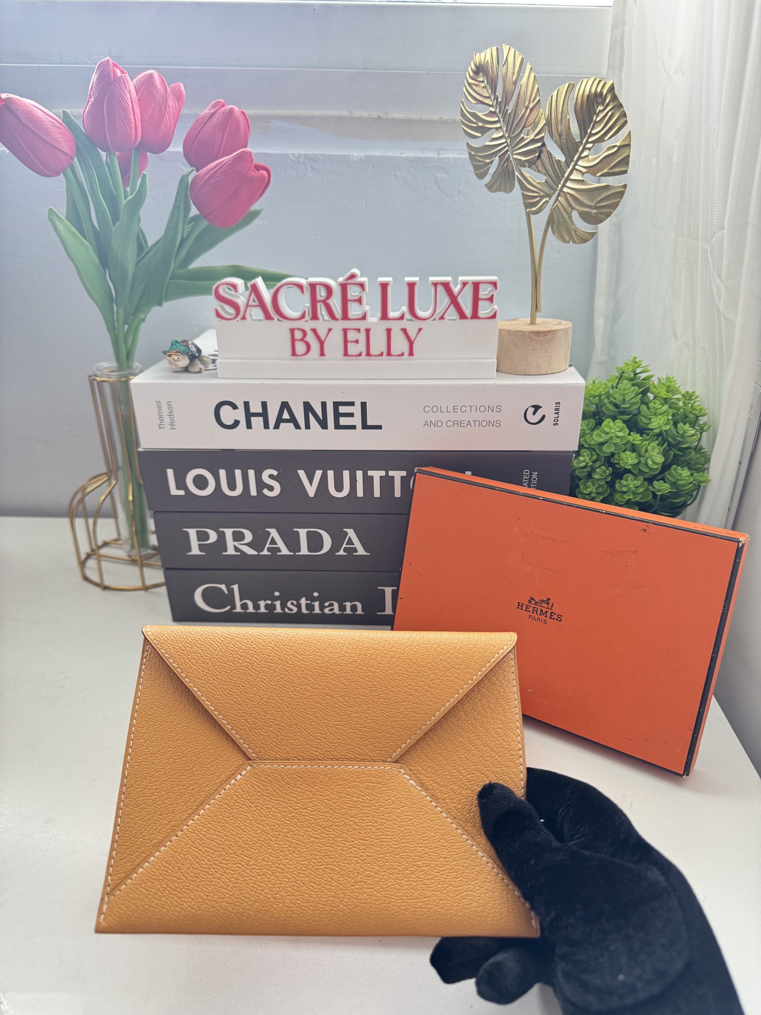 Hermès Envelope Wallet (Category: Luxury Bags & Wallets) located in Manila. Submitted by sacreluxebyelly (Listing ID 1421337644, Image 1). Description: - Authentic Hermès envelope wallet - Elegant yellow color - Unique geometric design with white stitching - Comes with original orange box - Stylish and functional accessory.