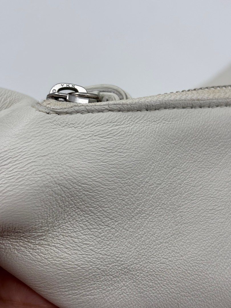 Lemaire Croissant Bag (Category: Cross-body Bags) located in Caloocan City. Submitted by rossvault2 (Listing ID 1421333470, Image 3). Description: - Lemaire croissant shoulder bag - Unique croissant shape - Zipper closure - Long strap - Interior small pocket - Made of leather - Fabric lining - Brand: Lemaire - Made in Spain -pls check photos norma signs of use.