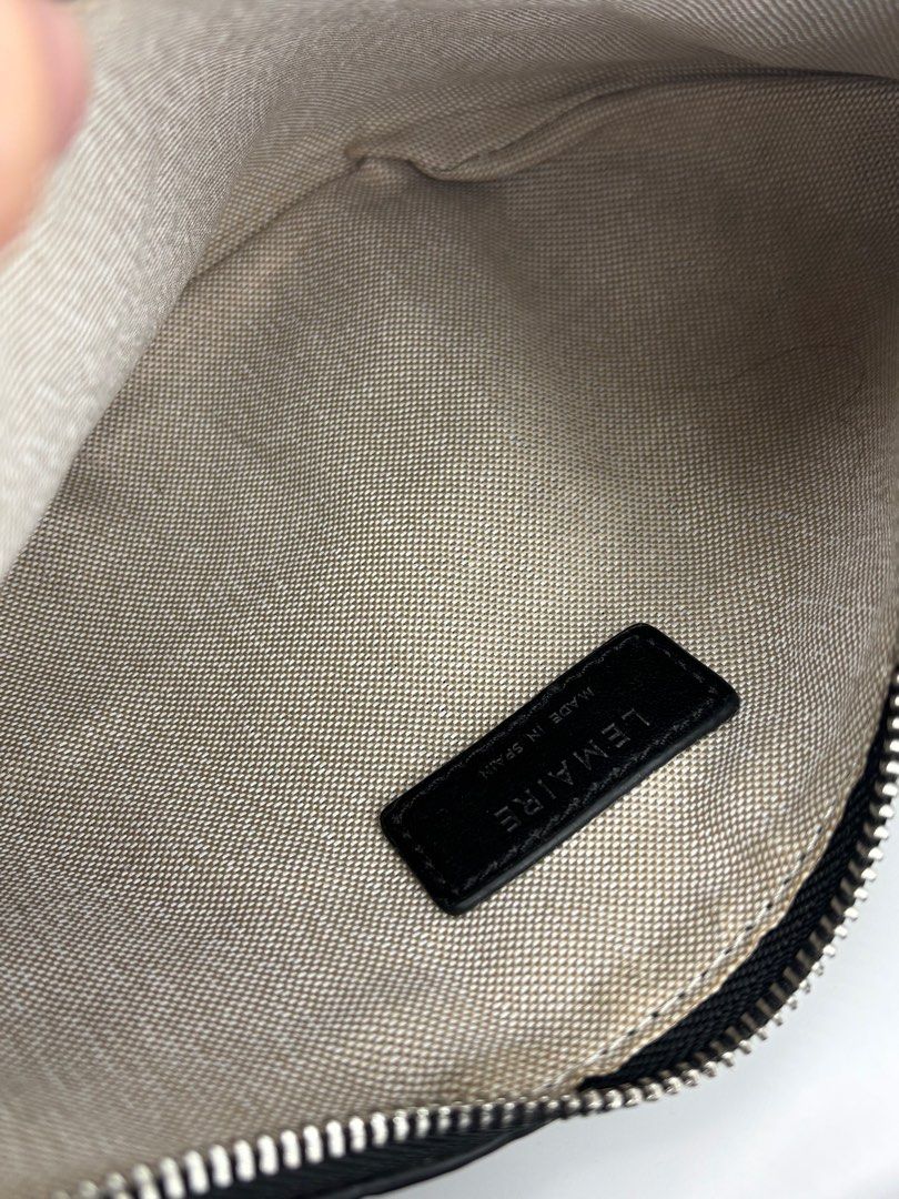 LEMAIRE Croissant Bag - Black (Category: Sling Bags) located in Caloocan City. Submitted by rossvault2 (Listing ID 1421336821, Image 3). Description: - Lemaire shoulder bag small - Black color - Distinctive croissant shape - Single shoulder strap - Secure zipper closure - Fabric interior - Features a small leather tag with brand details - Made in Spain -missing white tag.