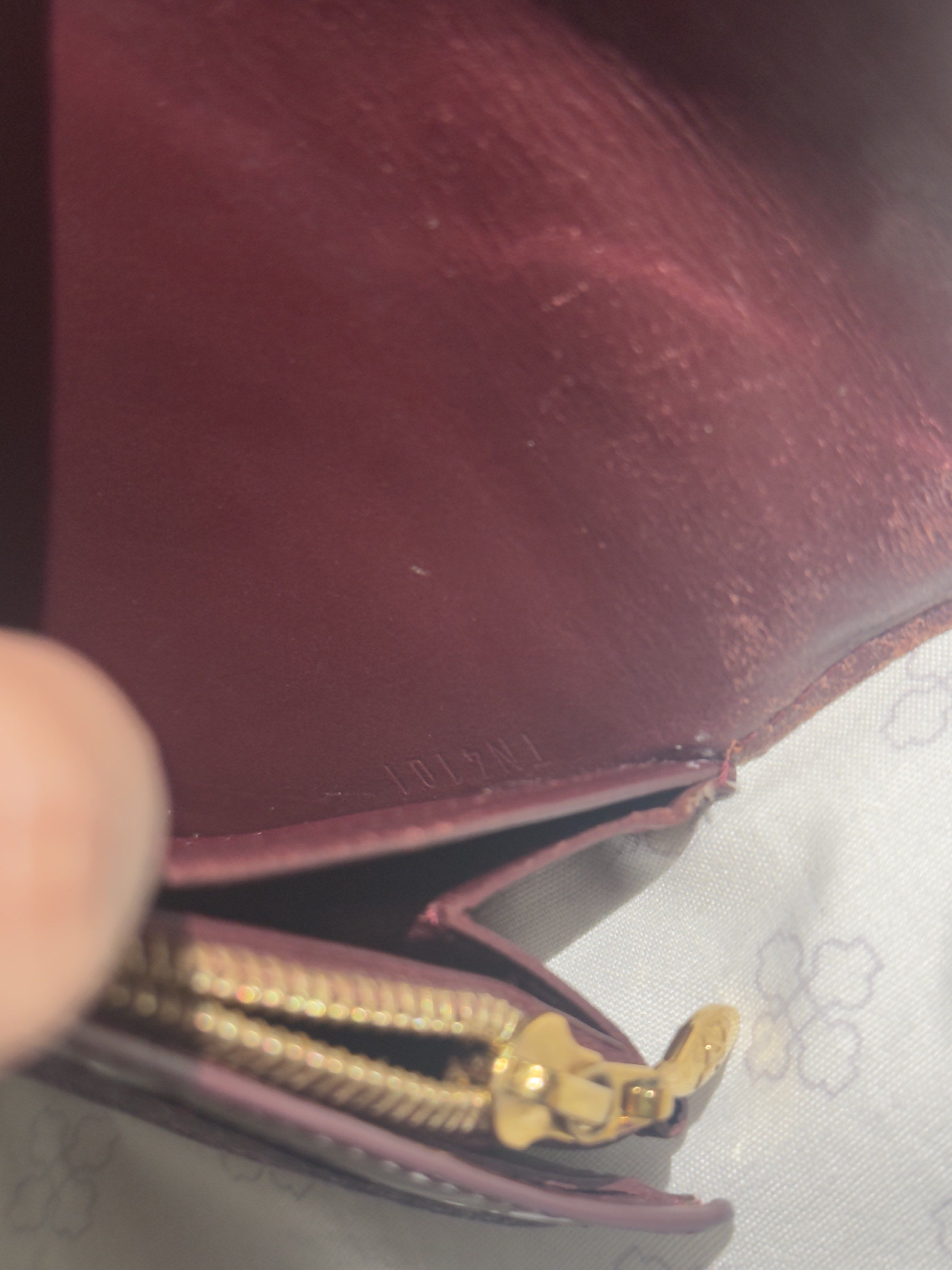 Louis Vuitton Vernis Wallet (Category: Luxury Bags & Wallets) located in Manila. Submitted by dripdistrict (Listing ID 1421391958, Image 3). Description: - Authentic Louis Vuitton Vernis wallet - Stunning burgundy color - Iconic LV monogram pattern - Gold-tone clasp and zipper - Includes serial number - Stylish and functional design.
