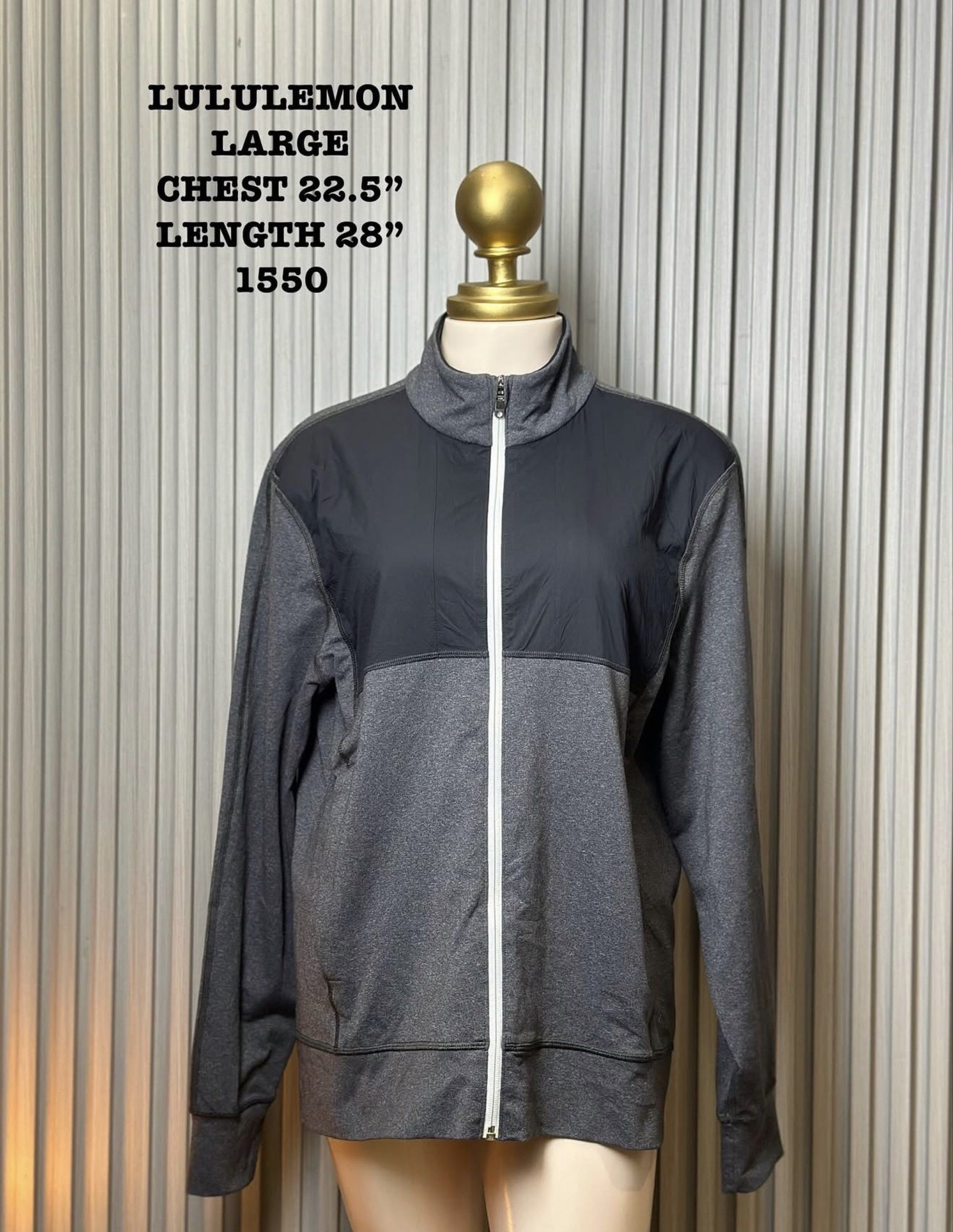 Lululemon Full Zip Jacket - Large (Category: Activewear) located in Naga. Submitted by ubi04 (Listing ID 1421371415, Image 1). Description: - Lululemon full zip jacket - Color: Gray and black - Size: Large - Features: - High collar - Front pockets - Thumb holes - White zipper - Lululemon logo on back - Measurements: - Chest: 22.5" - Length: 28".