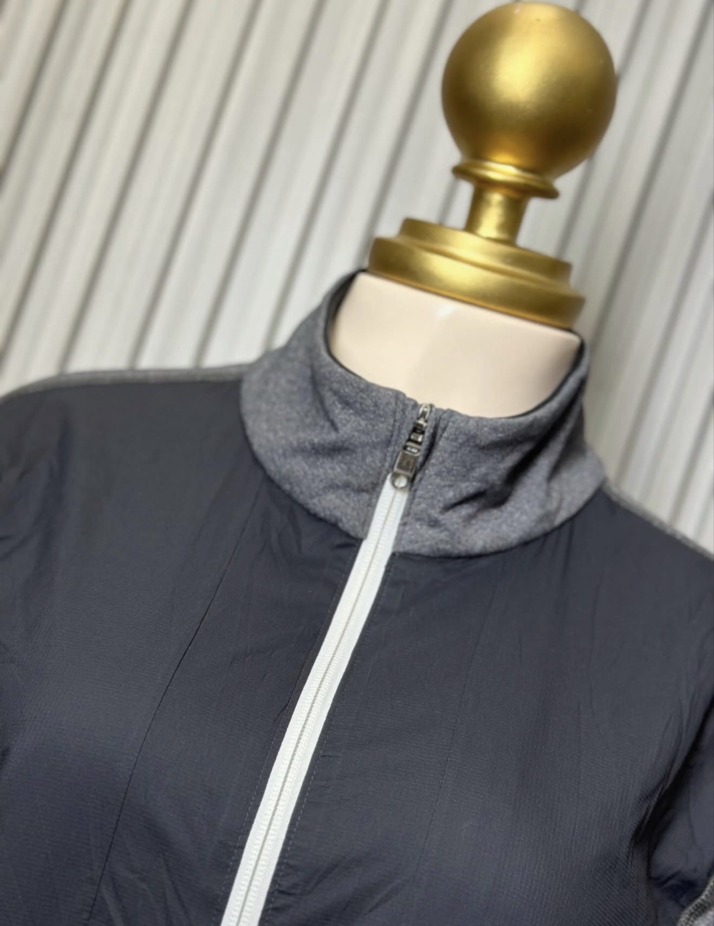 Lululemon Full Zip Jacket - Large (Category: Activewear) located in Naga. Submitted by ubi04 (Listing ID 1421371415, Image 3). Description: - Lululemon full zip jacket - Color: Gray and black - Size: Large - Features: - High collar - Front pockets - Thumb holes - White zipper - Lululemon logo on back - Measurements: - Chest: 22.5" - Length: 28".