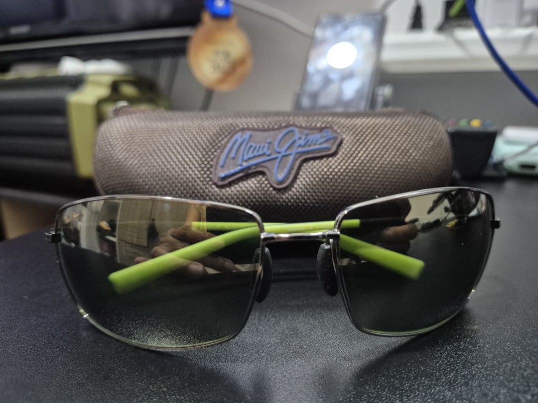 Maui Jim Sunglasses (Category: Sunglasses & Eyewear) located in Cagayan de Oro. Submitted by pxfindscdo (Listing ID 1421294811, Image 1). Description: - Authentic Maui Jim Ironwood sunglasses - Sleek gun metal gray frame with green accents - Dark lenses for superior sun protection - Model: MJ-320-15A - Made in Japan - Includes original case - Comfortable fit, ready to wear Mode of Payment: COP thru LBC.