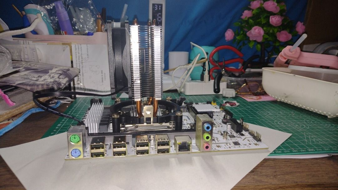 Motherboard with CPU Cooler (Category: Computer Parts) located in Caloocan City. Submitted by deokledus (Listing ID 1421434554, Image 2). Description: - White motherboard with CPU cooler - Corsair cooler model - Large heatsink and fan - Includes USB ports and RAM slots - Black and silver components negotiable, server motherboard ddr4 slots, outside paired then inside follow i didn't got memory but tested read all my gnu present showed me screen, 