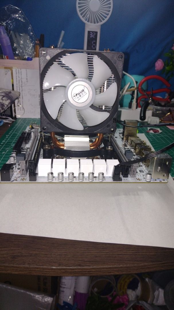 Motherboard with CPU Cooler (Category: Computer Parts) located in Caloocan City. Submitted by deokledus (Listing ID 1421434554, Image 3). Description: - White motherboard with CPU cooler - Corsair cooler model - Large heatsink and fan - Includes USB ports and RAM slots - Black and silver components negotiable, server motherboard ddr4 slots, outside paired then inside follow i didn't got memory but tested read all my gnu present showed me screen, 