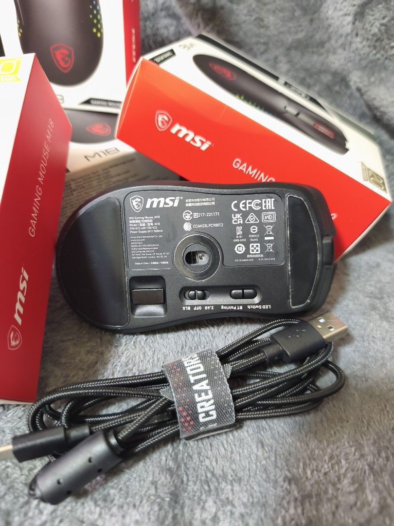 MSI M18 Gaming Mouse (Category: Mouse & Mousepads) located in Pasay City. Submitted by nanotechno11 (Listing ID 1421312368, Image 3). Description: MSI gaming mouse M18 Limited Edition 20th Anniversary Specifications: Resolution: 5000DPI(max) Accelaration: 20g Switch Life: 80 million times Power Supply: 5V – 500mA Connection Type: Wired. 2.4G. BLE Weight: 116g Size: 131 x 76 x x 43mm RGB LED: Yes – Diamond-shaped RGB lighting grip design Battery s