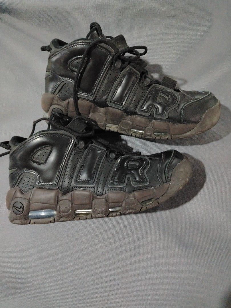 Nike Air More Uptempo Black (Category: Sneakers) located in Midsalip. Submitted by shoesselector (Listing ID 1421392502, Image 1). Description: - Nike Air More Uptempo - Black upper with brown sole - US size 10 - Iconic "AIR" branding - Nike logo on tongue and sole - Signs of wear on soles and uppers.