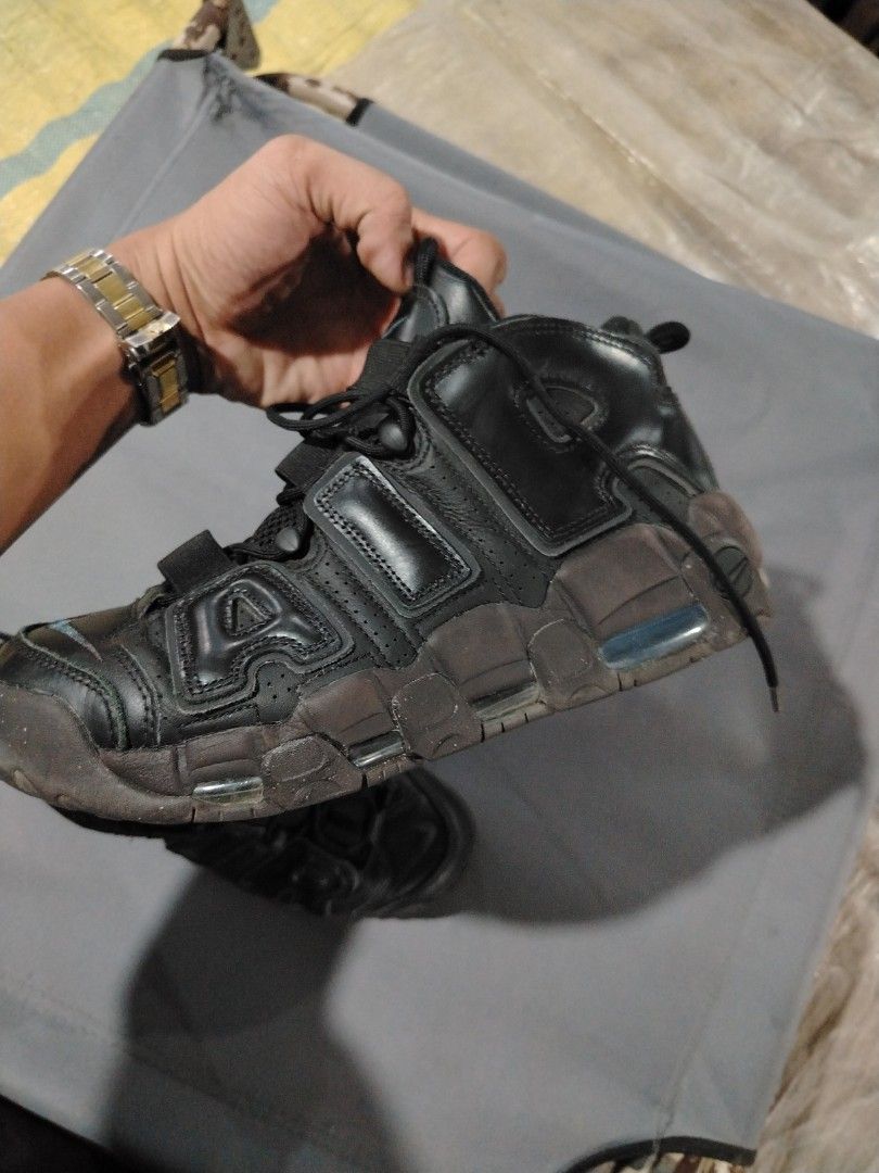 Nike Air More Uptempo Black (Category: Sneakers) located in Midsalip. Submitted by shoesselector (Listing ID 1421392502, Image 3). Description: - Nike Air More Uptempo - Black upper with brown sole - US size 10 - Iconic "AIR" branding - Nike logo on tongue and sole - Signs of wear on soles and uppers.