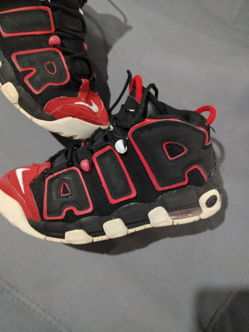 Nike Air More Uptempo Black Red (Category: Sneakers) located in Midsalip. Submitted by shoesselector (Listing ID 1421397190, Image 2). Description: Nike Air More Uptempo sneakers in black and red. Features the iconic "AIR" branding on the sides. The shoes have a black base with red accents and a white sole. The Nike swoosh logo is visible on the toe and heel. The size is US 5Y, UK 4.5, EUR 37.5, and CM 23.5..