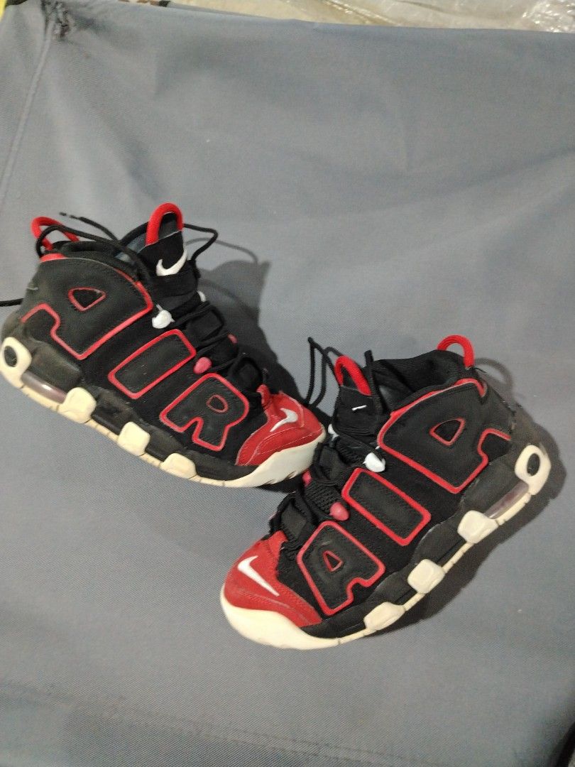 Nike Air More Uptempo Black Red (Category: Sneakers) located in Midsalip. Submitted by shoesselector (Listing ID 1421397190, Image 1). Description: Nike Air More Uptempo sneakers in black and red. Features the iconic "AIR" branding on the sides. The shoes have a black base with red accents and a white sole. The Nike swoosh logo is visible on the toe and heel. The size is US 5Y, UK 4.5, EUR 37.5, and CM 23.5..