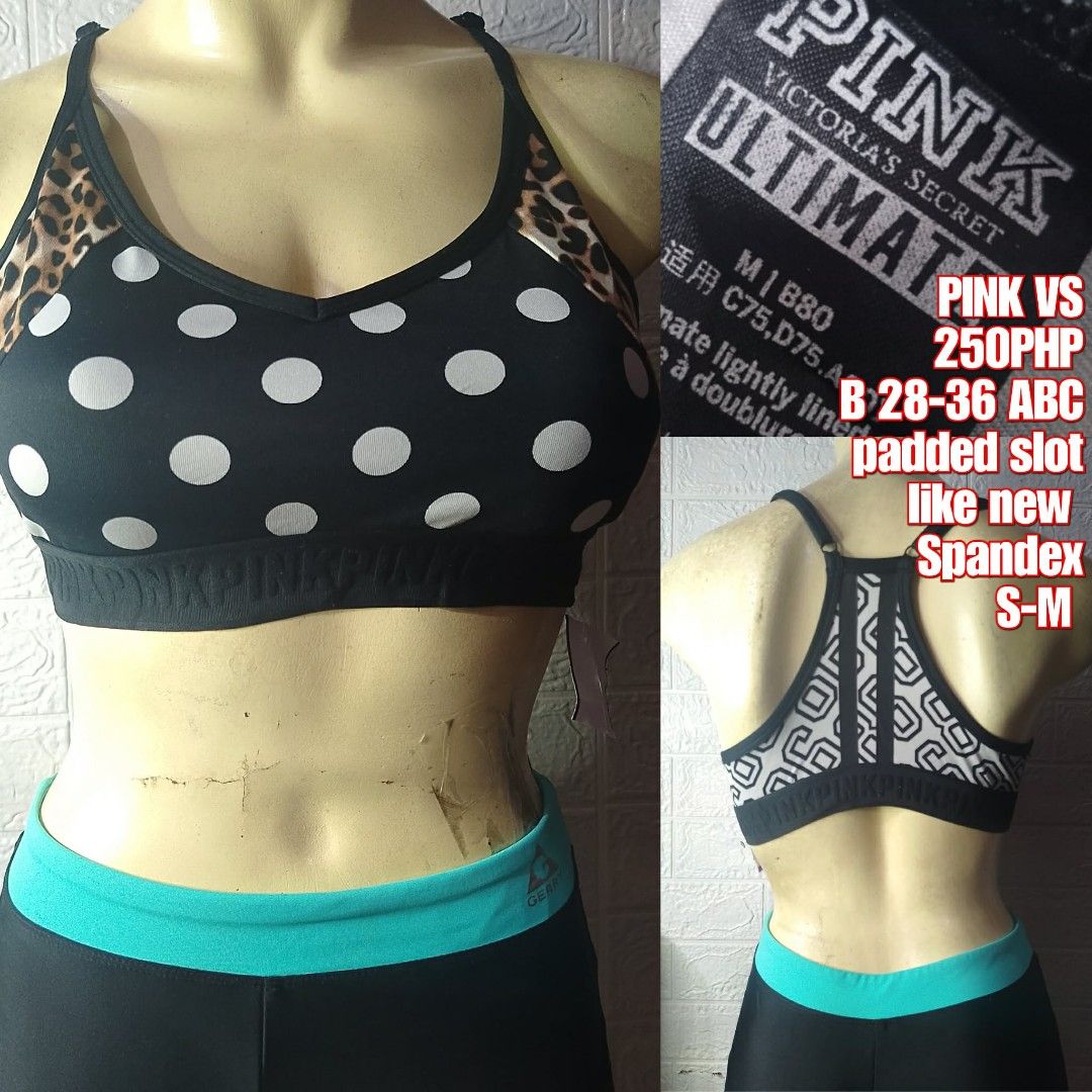 Pink Victoria's Secret Ultimate Sports Bra (Category: Activewear) located in Santa Maria. Submitted by usbrands1987 (Listing ID 1421436842, Image 1). Description: - Pink Victoria's Secret sports bra - Black base with white polka dots and leopard print accents - Includes padded slots - Size: S-M (fits B 28-36 ABC) - Material: Spandex - Features a black design with a turquoise band - Geometric design on the back.