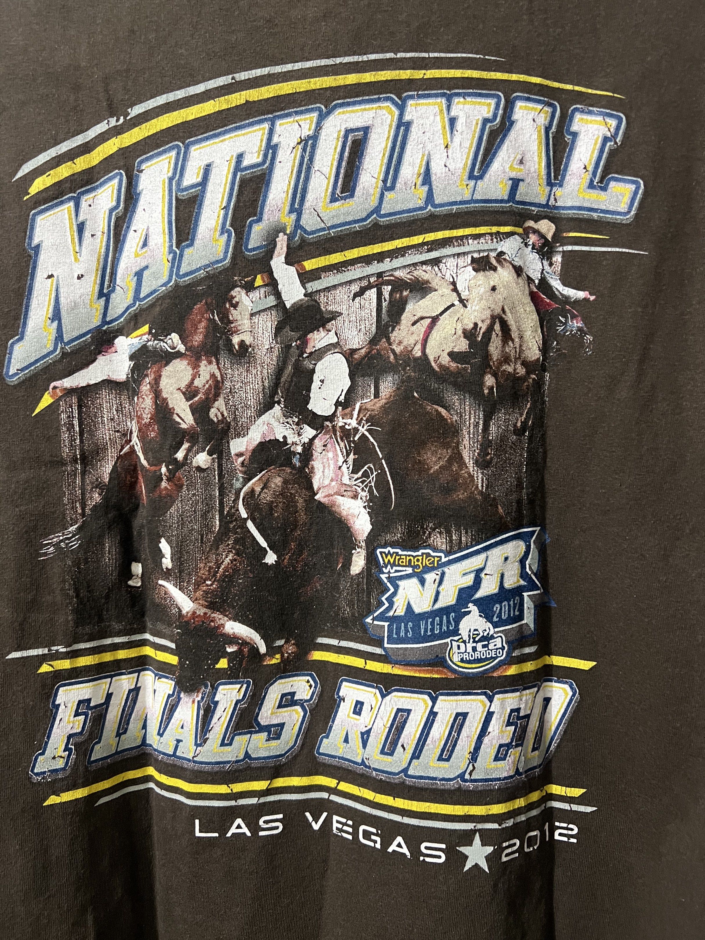 ProRodeo Gear NFR 2012 T-shirt (Category: Tshirts & Polo Shirts ) located in Pasay City. Submitted by chasss_09 (Listing ID 1421426368, Image 3). Description: - Brown ProRodeo Gear T-shirt from the 2012 National Finals Rodeo. - Features a small logo on the front. - Large graphic on the back. - Classic crew neck and short sleeves. - Official outfitter of the PRCA..