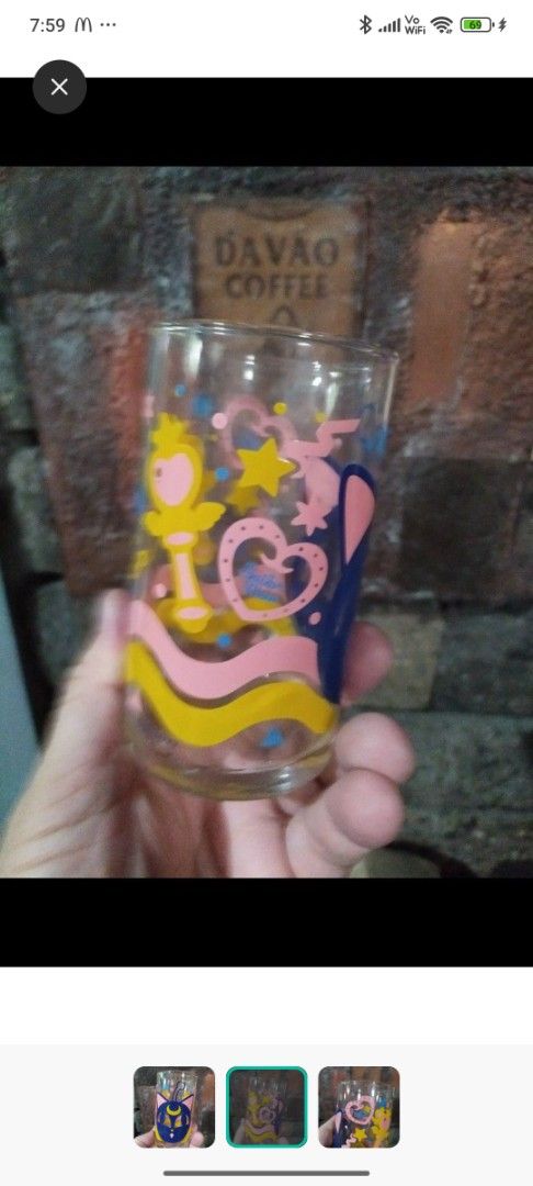 Sailor Moon Glass (Category: Dinnerware & Cutlery) located in Caloocan City. Submitted by toys_r_here (Listing ID 1421380230, Image 2). Description: - Sailor Moon themed glass. - Features a blue cat face with a crescent moon. - Includes other Sailor Moon character designs. - Clear glass with colorful graphics..