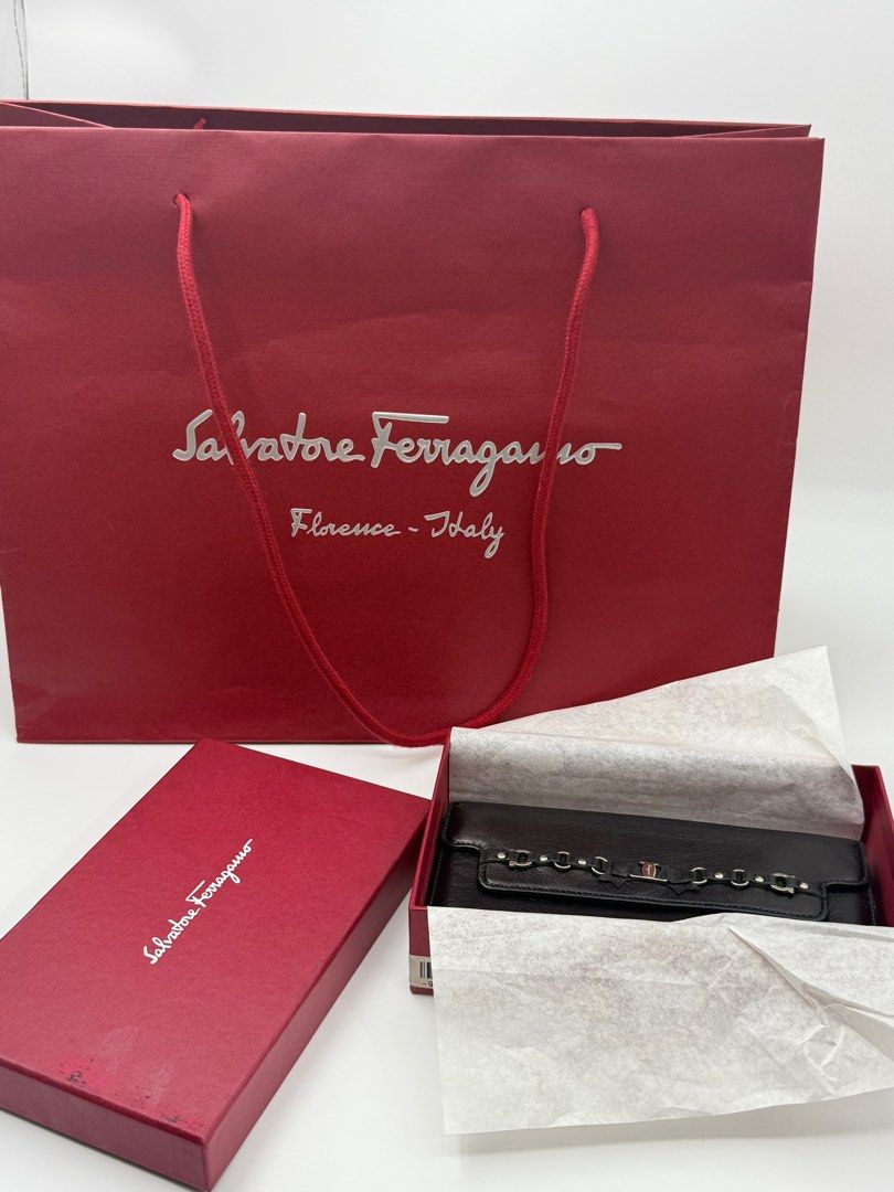Salvatore Ferragamo Black Leather Wallet (Category: Luxury Bags & Wallets) located in Caloocan City. Submitted by rossvault2 (Listing ID 1421326426, Image 1). Description: Authentic Salvatore Ferragamo wallet in black leather. Features multiple card slots and compartments. Includes original box and shopping bag. Made in Italy. The wallet has a snap closure and a decorative metal detail on the front. -with box and paper bag -authentic -salvatore f