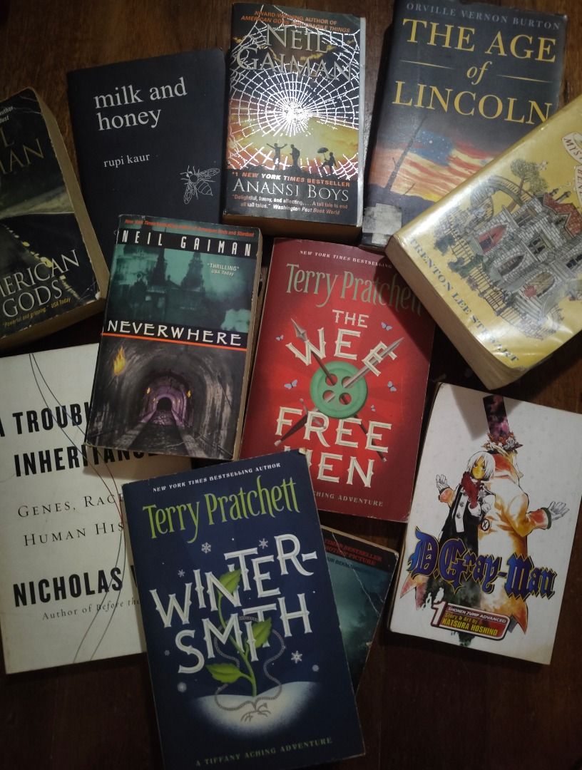 [TAKE ALL] 11 BOOKS FOR 2,000 - 200 each (Category: Storybooks) located in Dasmarinas. Submitted by cacailin (Listing ID 1421360125, Image 1). Description: Collection of assorted paperback books including titles by Neil Gaiman, Terry Pratchett, and others. Titles include "Anansi Boys", "American Gods", "Neverwhere", "Abraham Lincoln: Vampire Hunter", "milk and honey", "D.Gray-Man", "The Mysterious Benedict Society", "Wintersmith", "The Wee Free M