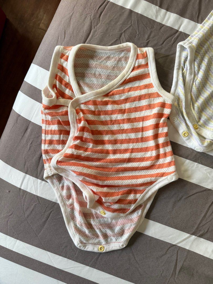 Uniqlo Mesh Onesies (Category: Babies & Kids Fashion) located in Paranaque City. Submitted by declutteringFA (Listing ID 1421292777, Image 2). Description: - Uniqlo Mesh Onesies - Size 80 (fits 6-9 months) - Breathable mesh material - Selling as a bundle only - orange one is size 60, pink onesie has stains .