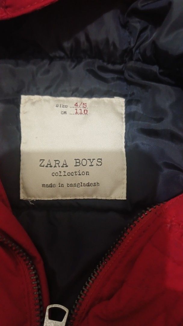 Zara Boys Red Winter Jacket with Hood (Category: Babies & Kids Fashion) located in Urbiztondo. Submitted by owiesreyes (Listing ID 1421397785, Image 2). Description: - Zara Boys Red Winter jacket - Size: 4/5 (110) - Features: Hood, zipper closure, front pockets, sleeve pocket - Design: Ribbed hem and cuffs - Made in Bangladesh - Perfect for your child's outerwear needs.