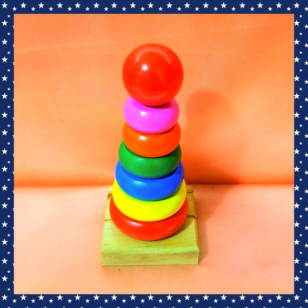 7-Layer Rainbow Tower Stacking Toy (Category: Infant Playtime) located in Caloocan City. Submitted by happyfeelbygif777 (Listing ID 1421538827, Image 1). Description: ❤7 layers of round wooden Rainbow Tower stacking toy for toddlers ❤Suitable for children aged 36 months and up. ❤Comes with a box. ❤Features a wooden base and colorful rings. Includes a red ball on top. ❤Helps develop hand-eye coordination ❤Aids in color recognition. ❤Great educatio
