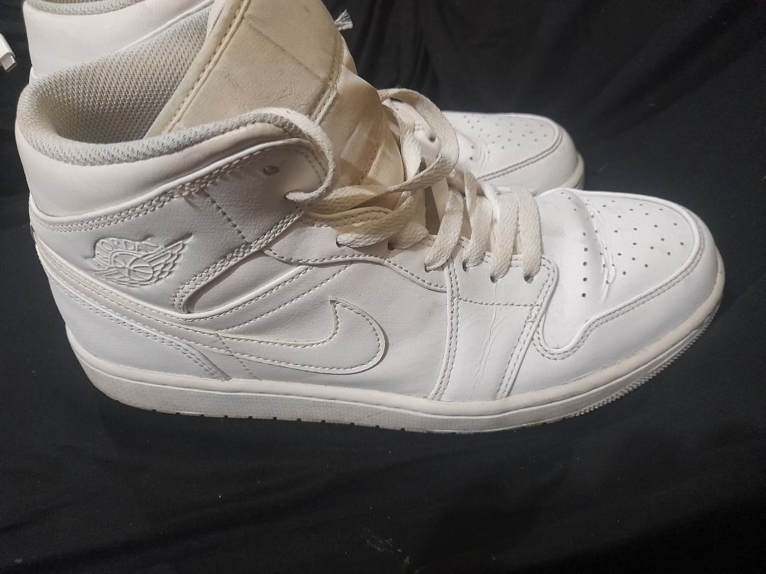 Air Jordan 1 Mid White Sneakers (Category: Sneakers) located in Quezon City. Submitted by rogel75aug (Listing ID 1421505763, Image 3). Description: - White Air Jordan 1 Mid sneakers - Features the iconic Air Jordan logo - High-top design with laces - Perforated toe box - White sole.