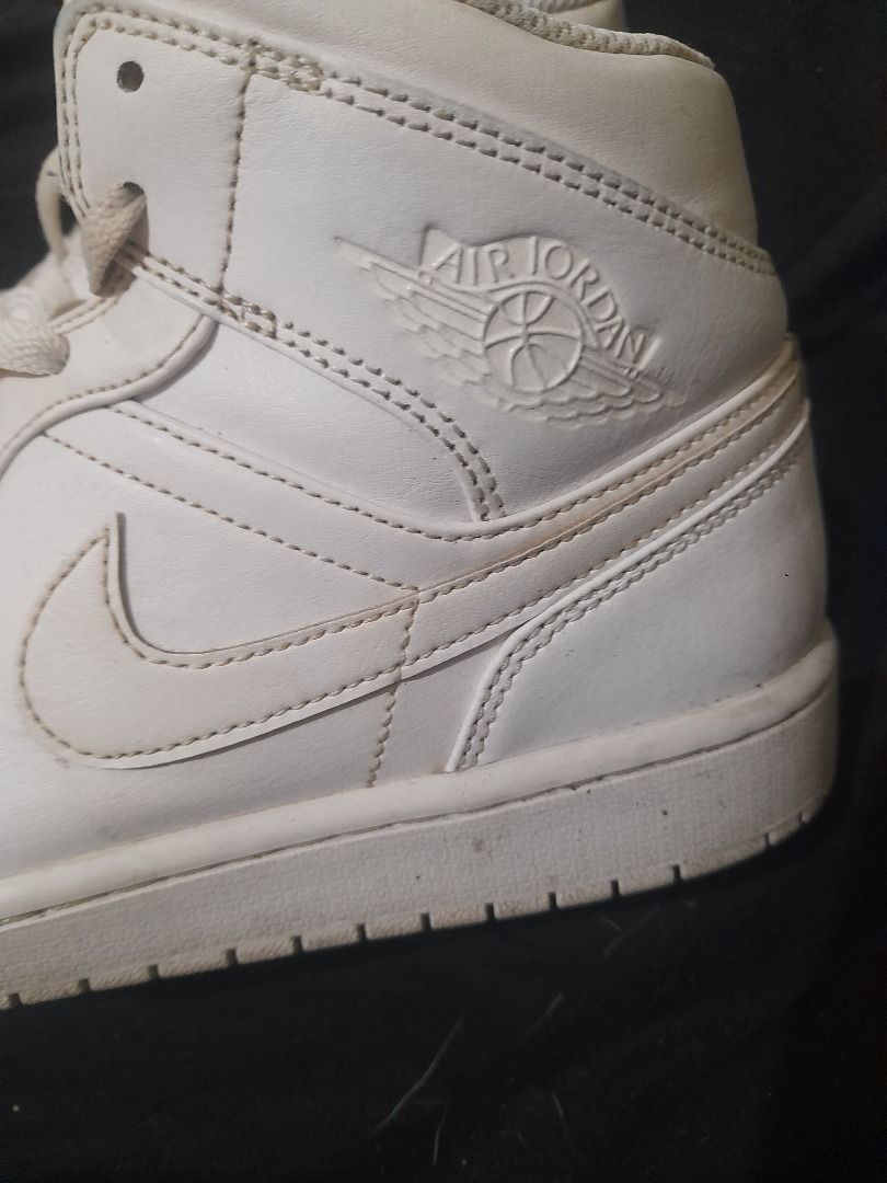Air Jordan 1 Mid White Sneakers (Category: Sneakers) located in Quezon City. Submitted by rogel75aug (Listing ID 1421505763, Image 2). Description: - White Air Jordan 1 Mid sneakers - Features the iconic Air Jordan logo - High-top design with laces - Perforated toe box - White sole.
