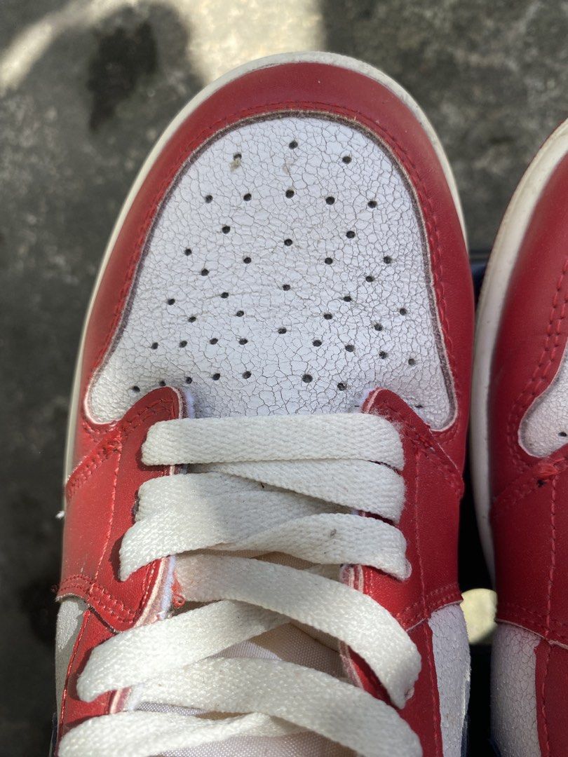 Air Jordan 1 Retro High OG (Category: Sneakers) located in Bacolod City. Submitted by 0411a (Listing ID 1421618119, Image 3). Description: Classic Air Jordan 1 Retro High OG sneakers. Features a red, white, and black colorway with the iconic Nike swoosh. The shoes have a high-top design with a padded collar. The soles show some wear. Made in Vietnam. thrifted so declared as off/legit.