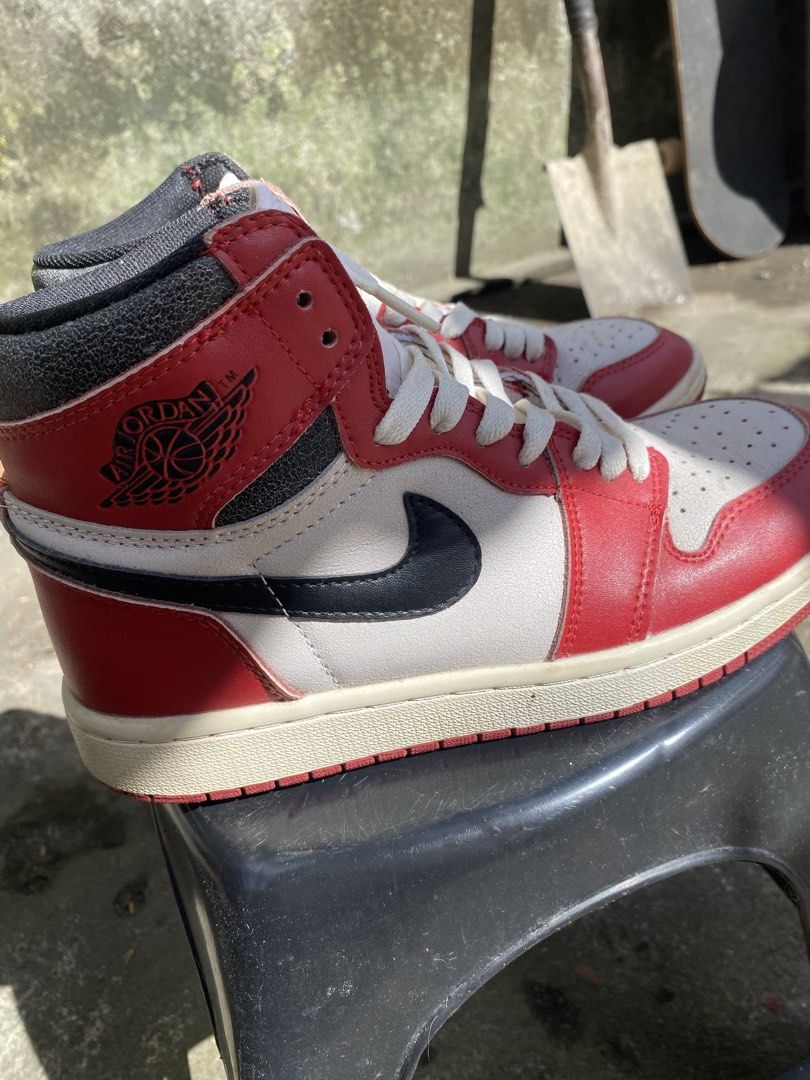 Air Jordan 1 Retro High OG (Category: Sneakers) located in Bacolod City. Submitted by 0411a (Listing ID 1421618119, Image 1). Description: Classic Air Jordan 1 Retro High OG sneakers. Features a red, white, and black colorway with the iconic Nike swoosh. The shoes have a high-top design with a padded collar. The soles show some wear. Made in Vietnam. thrifted so declared as off/legit.
