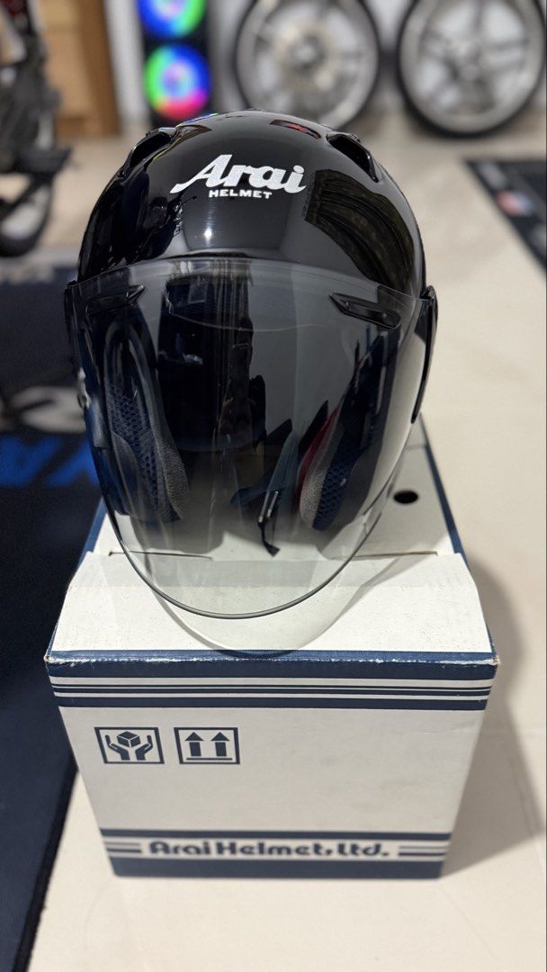 Arai szf Helmet - Black size S (Category: Motorcycle Accessories) located in Singapore. Submitted by sneakerswho (Listing ID 1421609119, Image 1). Description: - Sleek black design - Clear visor - Includes box - Clean and well-maintained interior padding - Ready for safety and style.