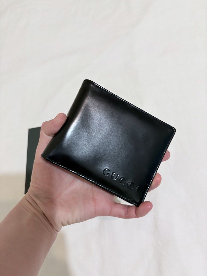 Authentic Vintage Gucci Men’s Bifold leather wallet (Category: Luxury Bags & Wallets) located in Quezon City. Submitted by herluxe_official (Listing ID 1421600639, Image 2). Description: - Authentic Gucci wallet - Black leather - Embossed Gucci logo - Includes original box and control card - Multiple card slots - Clear ID window.