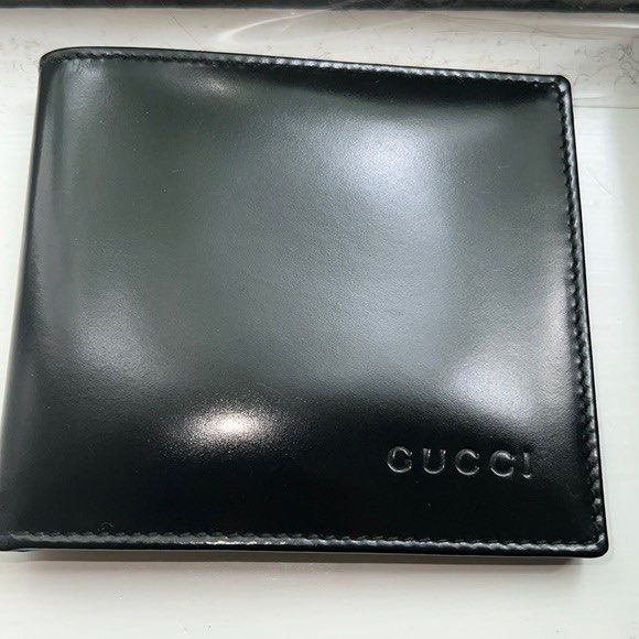 Authentic Vintage Gucci Men’s Bifold leather wallet (Category: Luxury Bags & Wallets) located in Quezon City. Submitted by herluxe_official (Listing ID 1421600639, Image 1). Description: - Authentic Gucci wallet - Black leather - Embossed Gucci logo - Includes original box and control card - Multiple card slots - Clear ID window.