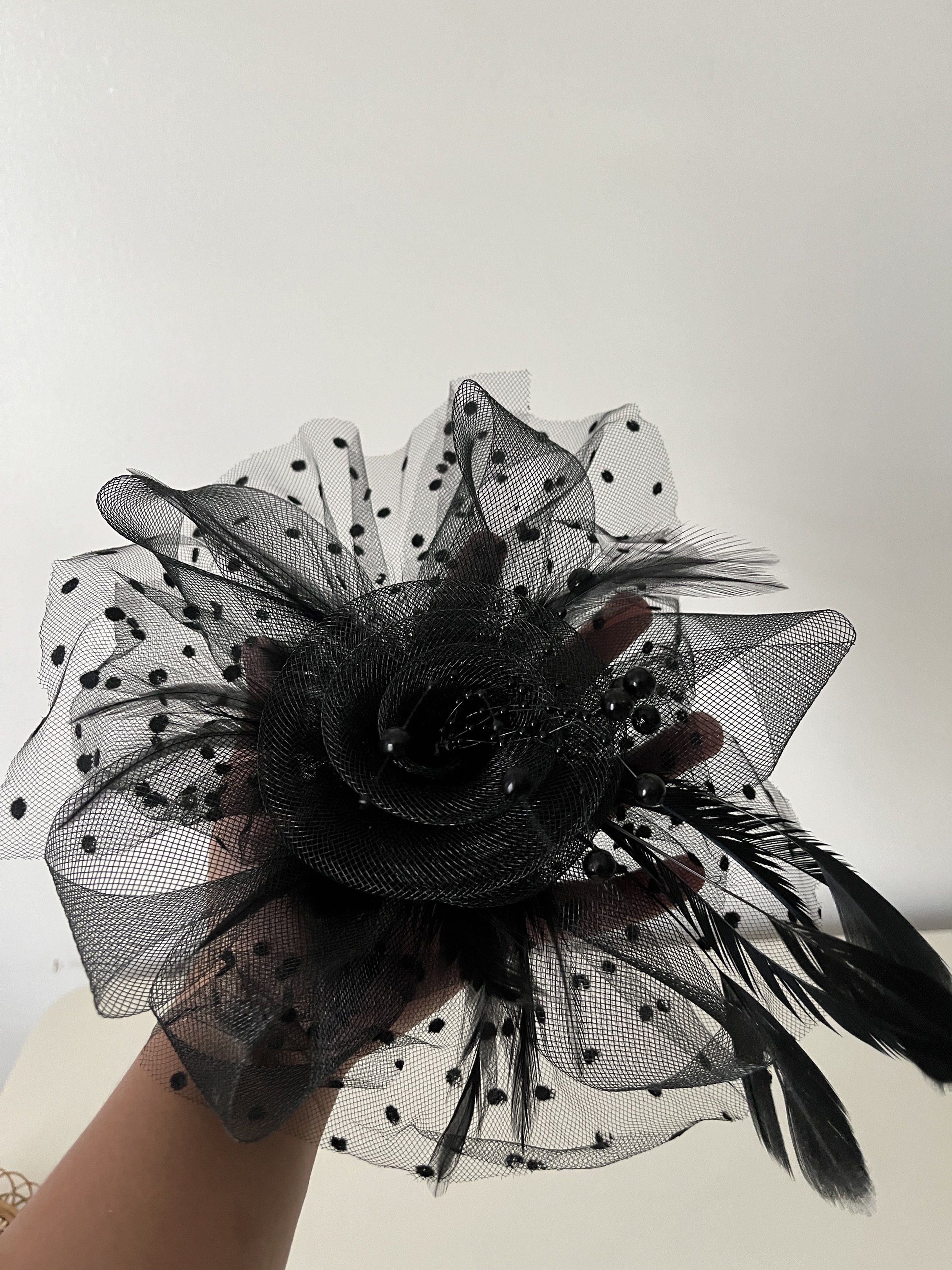 Black Rose Headband with Feathers (Category: Hair Accessories) located in Muntinlupa City. Submitted by little.declutter (Listing ID 1421517019, Image 3). Description: - Black headband with fabric rose - Dotted mesh and delicate feathers - Embellished with small black beads - Thin, black plastic headband - Ideal for special events or adding flair.