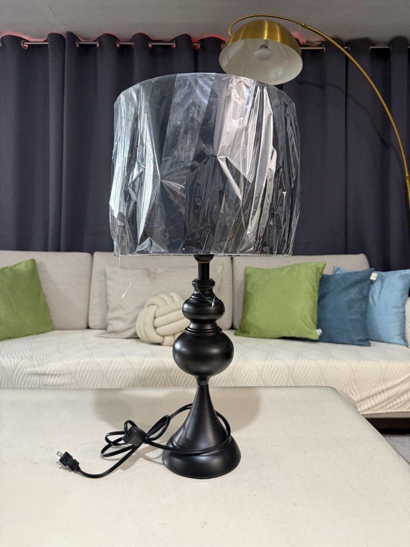 Black Table Lamp (Category: Lighting) located in Makati City. Submitted by rctrading (Listing ID 1421602459, Image 2). Description: - Elegant black table lamp - Classic design - Black lampshade and base - Comes with a power cord - Ideal for bedside or living room - Adds a touch of sophistication - 1st photo for reference only - 62cm height x 30cm diameter (shade).