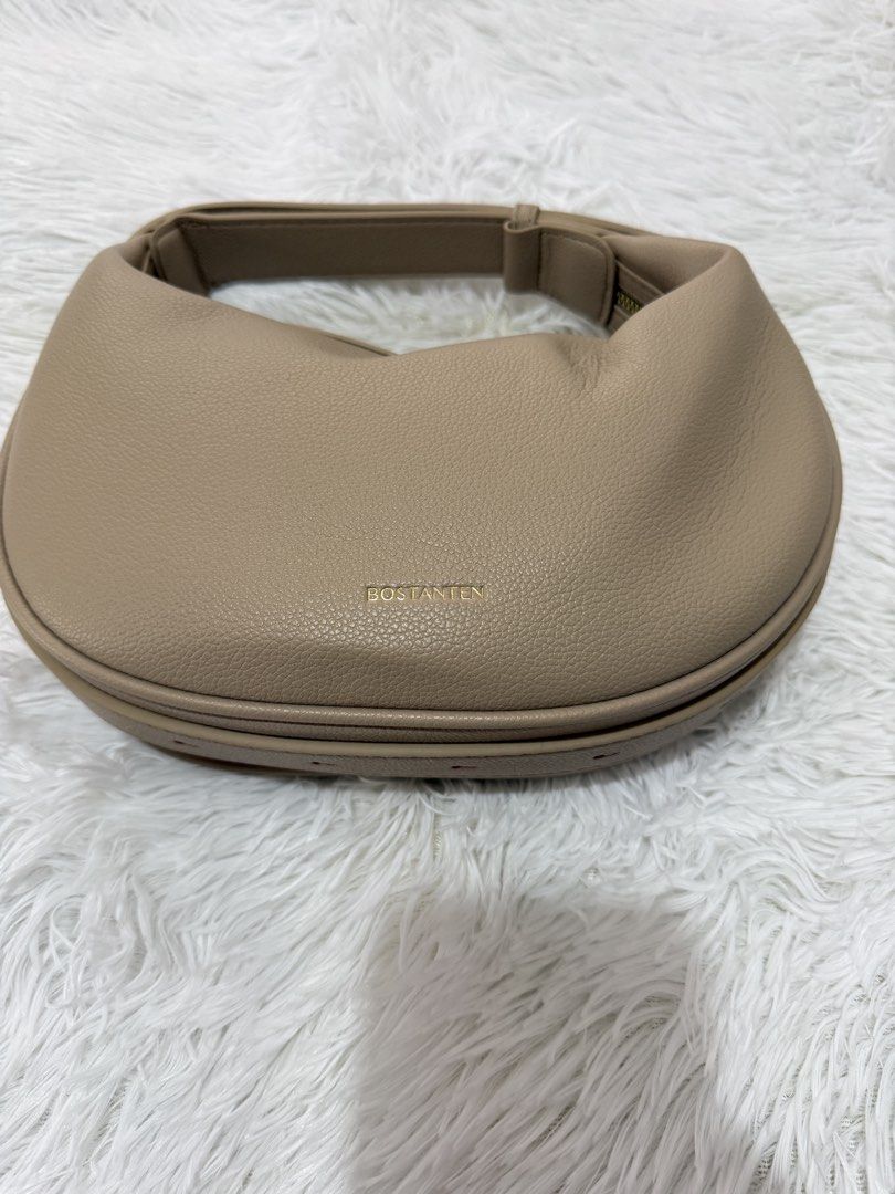 BOSTANTEN Crescent Bag (Category: Shoulder Bags) located in Cavite. Submitted by 0825cherry (Listing ID 1421472848, Image 2). Description: - BOSTANTEN crescent handbag - Stylish design - Top handle - Secure zippered closure - Textured material - Gold-toned zipper - Features the BOSTANTEN logo - Neutral color, versatile for various outfits.