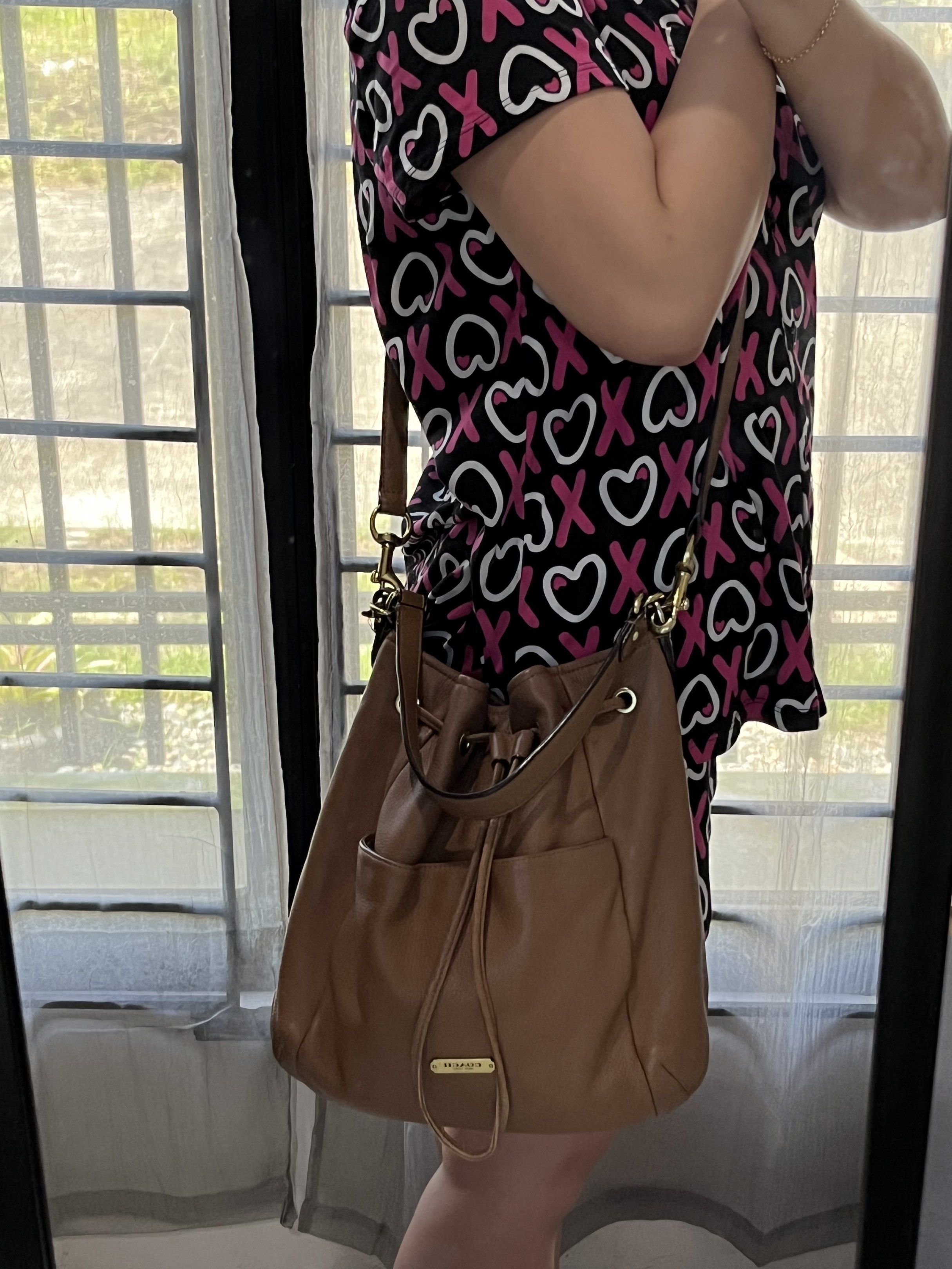 Coach Avery Leather Drawstring Bucket Bag (Category: Luxury Bags & Wallets) located in Bacolod City. Submitted by gin.knee (Listing ID 1421490151, Image 3). Description: - Coach drawstring bucket bag - Brown color - Drawstring closure - Adjustable shoulder strap - Exterior pocket - Interior zippered pocket - Gold-tone hardware ❌ With fading on hardware.