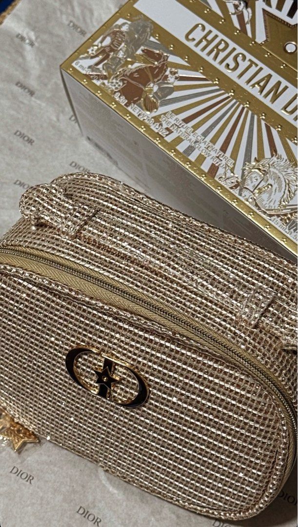 Dior Holiday 2025 Sparkling Makeup Pouch (Category: Purses & Pouches) located in Plaridel. Submitted by itslouisem (Listing ID 1421528532, Image 1). Description: - Dior Holiday 2025 Sparkling Makeup Pouch - Gold, sparkling exterior - Zipper closure - Features Dior logo - White fabric interior - Comes with original box - Perfect for stylish makeup storage.