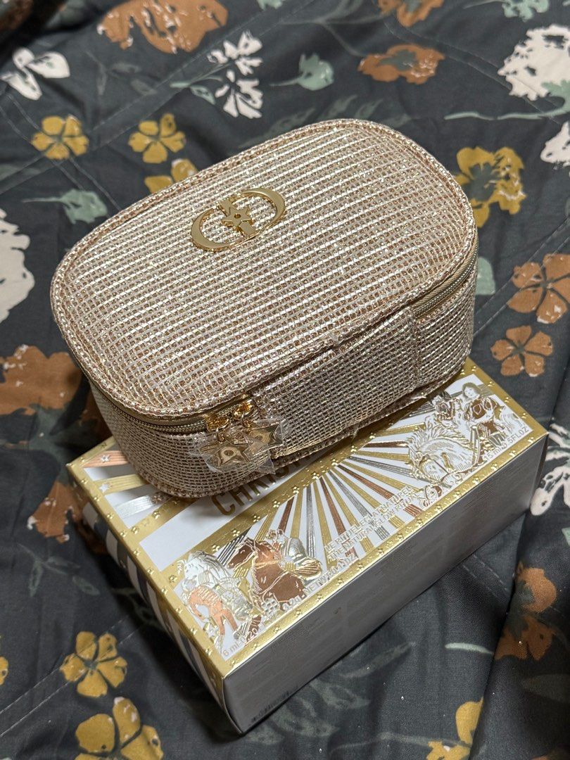 Dior Holiday 2025 Sparkling Makeup Pouch (Category: Purses & Pouches) located in Plaridel. Submitted by itslouisem (Listing ID 1421528532, Image 3). Description: - Dior Holiday 2025 Sparkling Makeup Pouch - Gold, sparkling exterior - Zipper closure - Features Dior logo - White fabric interior - Comes with original box - Perfect for stylish makeup storage.