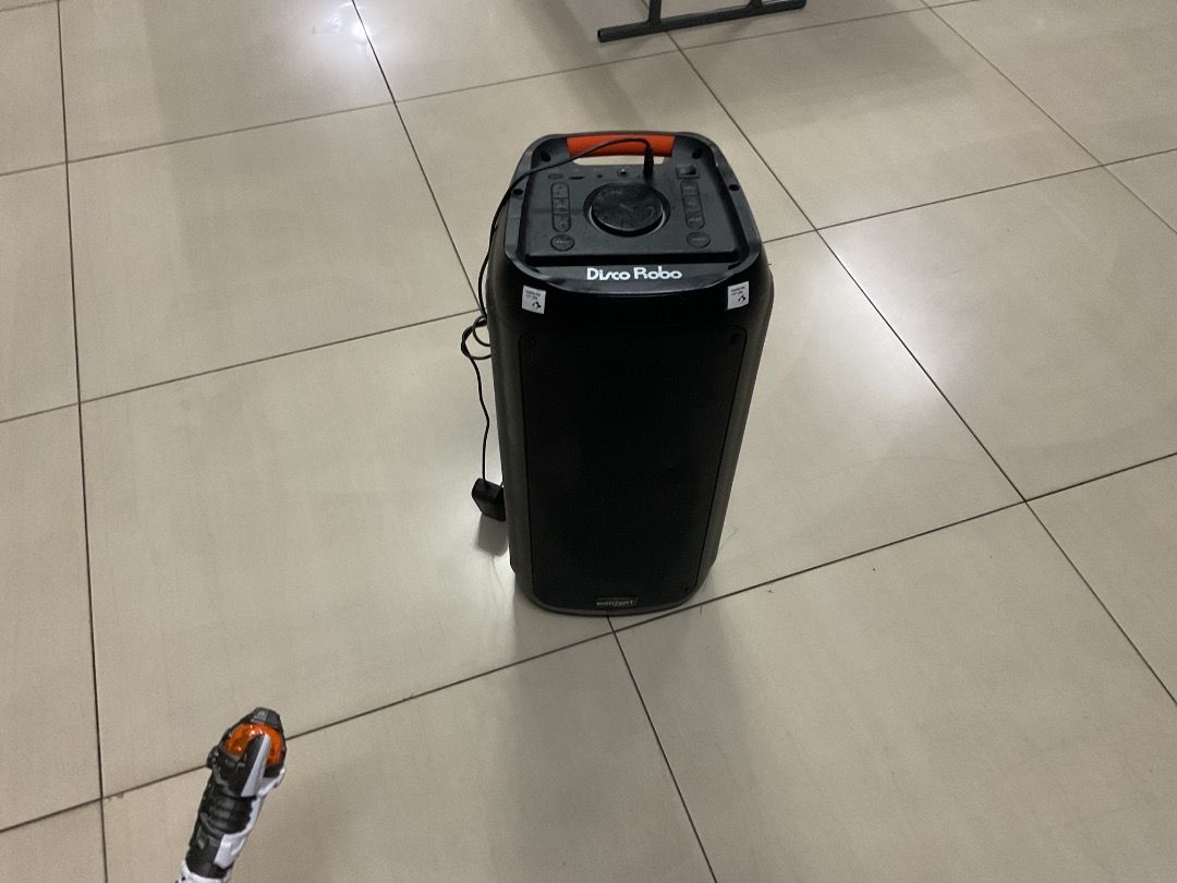 Disco Robo 5 speaker (Category: Soundbars, Speakers & Amplifiers) located in Quezon City. Submitted by gcnt_trift_store (Listing ID 1421587048, Image 1). Description: Disco Robo 5 PORTABLE PARTY SPEAKER • 3500 PMPO • BLUETOOTH + TWS • FM TUNER • USB PLAYBACK • USB MIC RECORDING • MICRO SD PLAYBACK • AUX IN • 1 WIRELESS UHF MIC 1 WIRED MIC INPUT • 5.5" × 2 WOOFER • 2" TWEETER • 4400mAh BATTERY • FIRE LED PARTY LIGHT.