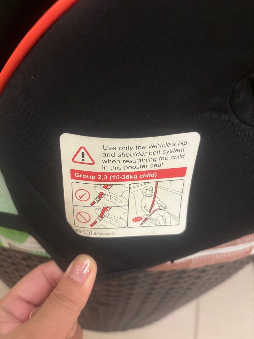 Evenflo Booster Car Seat (Category: Car Seats) located in Manila. Submitted by jrlua (Listing ID 1421565613, Image 3). Description: Evenflo booster car seat for Group 2,3 (15-36kg child). Features a black and grey seat with orange accents. Includes a seat belt guide. The seat has a headrest and side supports. The seat is designed to be used with the vehicle's lap and shoulder belt system. .