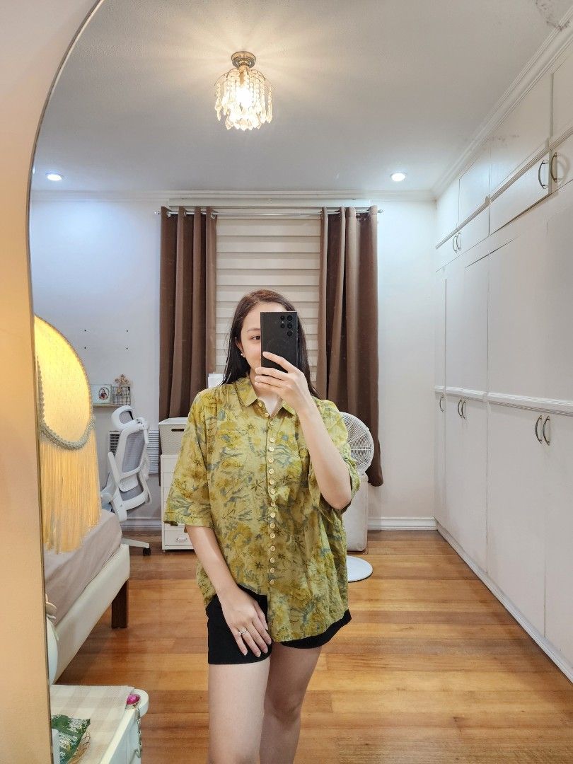 Floral Button-Down Blouse Large (Category: Blouses) located in Cagayan de Oro. Submitted by declutter97 (Listing ID 1421505360, Image 2). Description: - Floral print blouse - Button-down style - Collared neckline - Relaxed, slightly oversized fit - Yellow and green color - Used once.